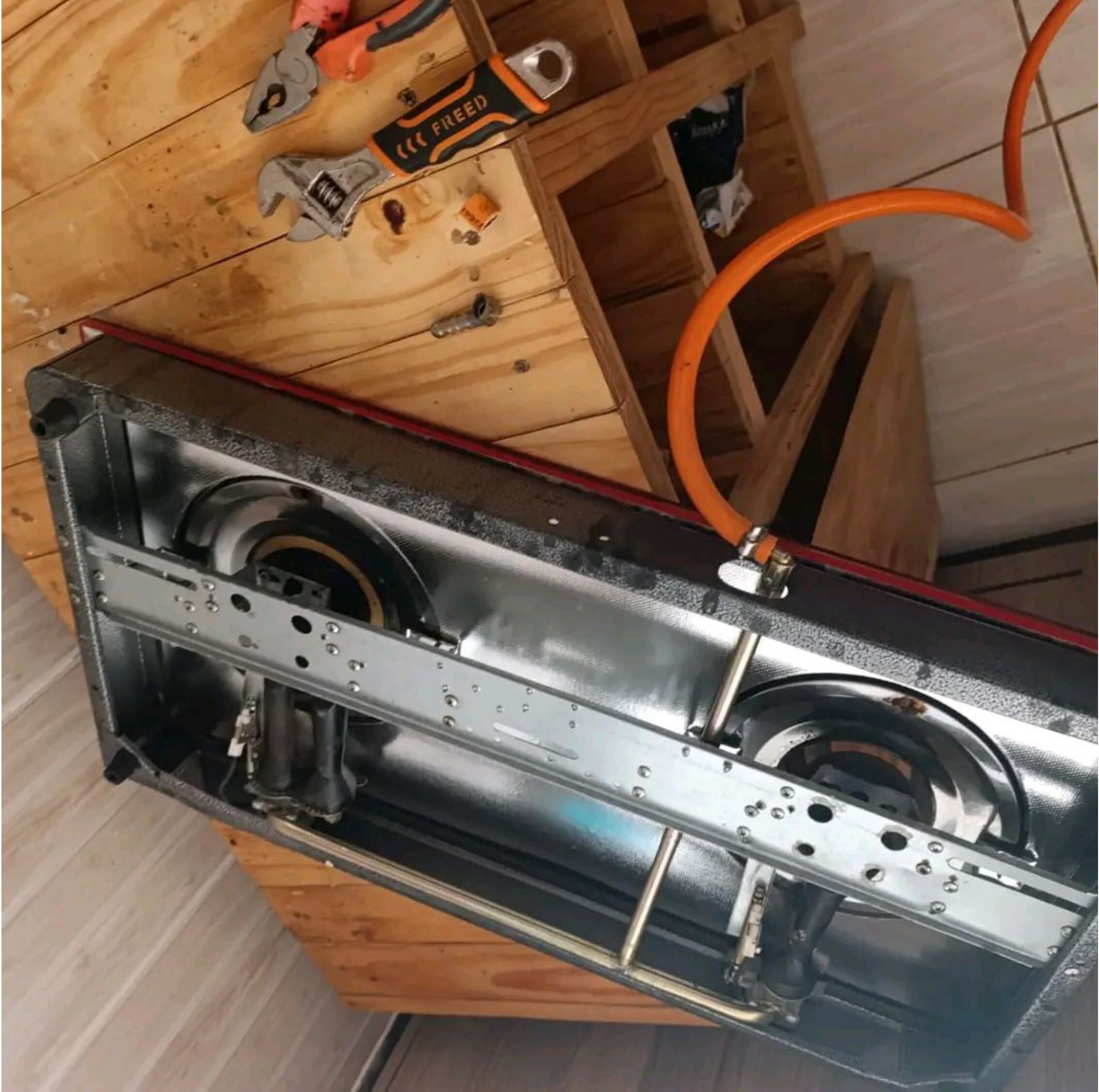 Gas stove top disassembled for service